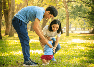 Mental Health Awareness Image of Family in Park With Infant