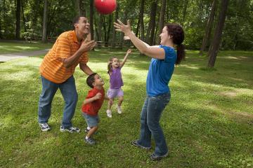 Physical Activity Family Playing Outside with Ball