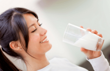 Woman Drinking a Glass of Milk