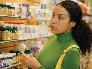 Woman Shopping in Supplement Aisle